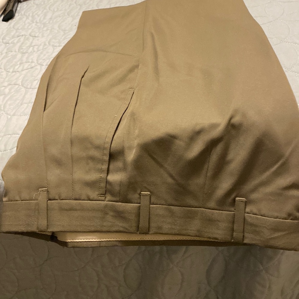 Boy’s pleated olive green slacks.  Boy size 14